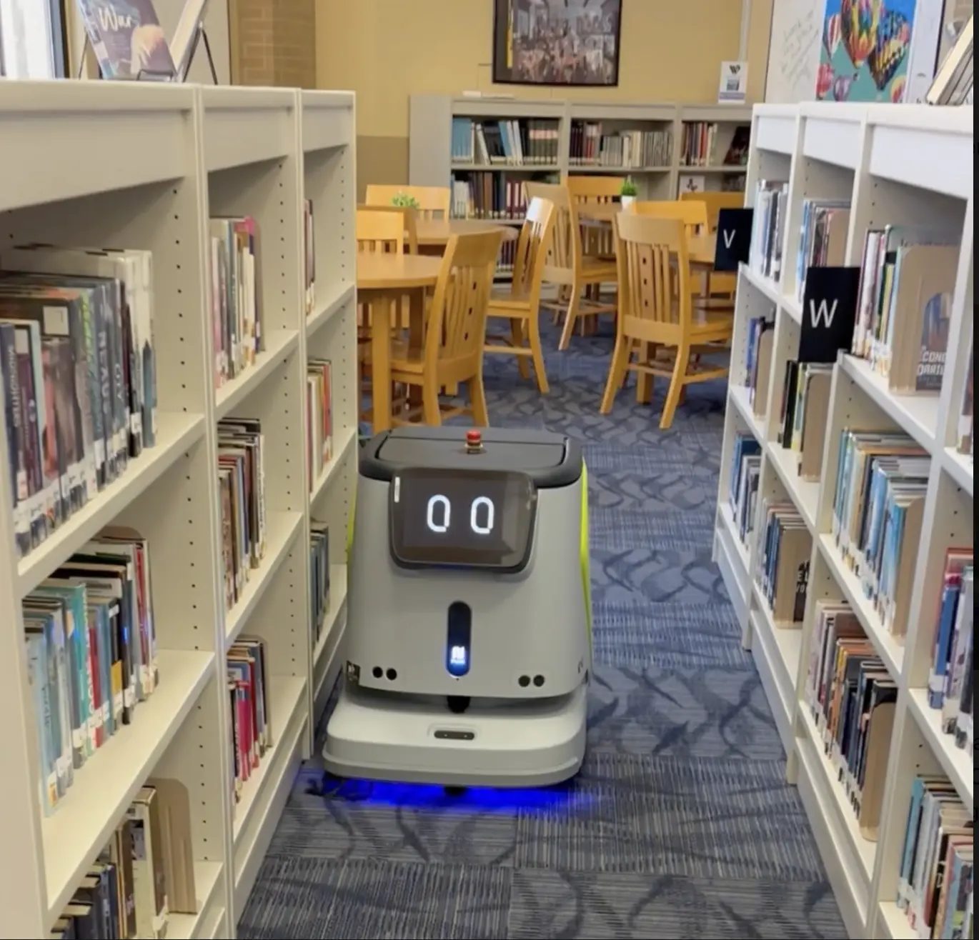 A CC1 scrubber working between library shelving